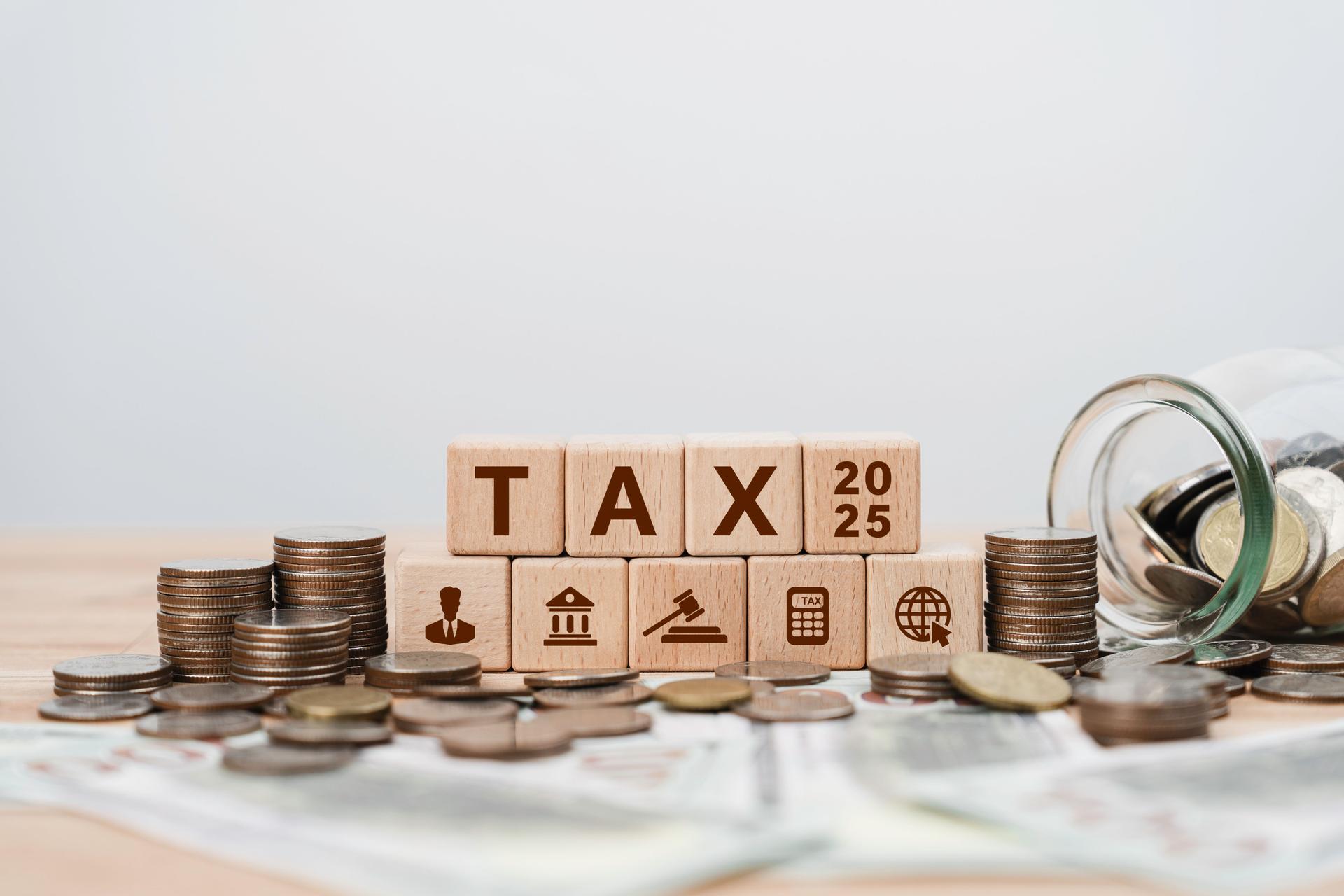 Tax planning 2025 concept with icons on wooden blocks Tax reduction, Individual income return to Government. paperwork, financial research, report. Calculation tax return