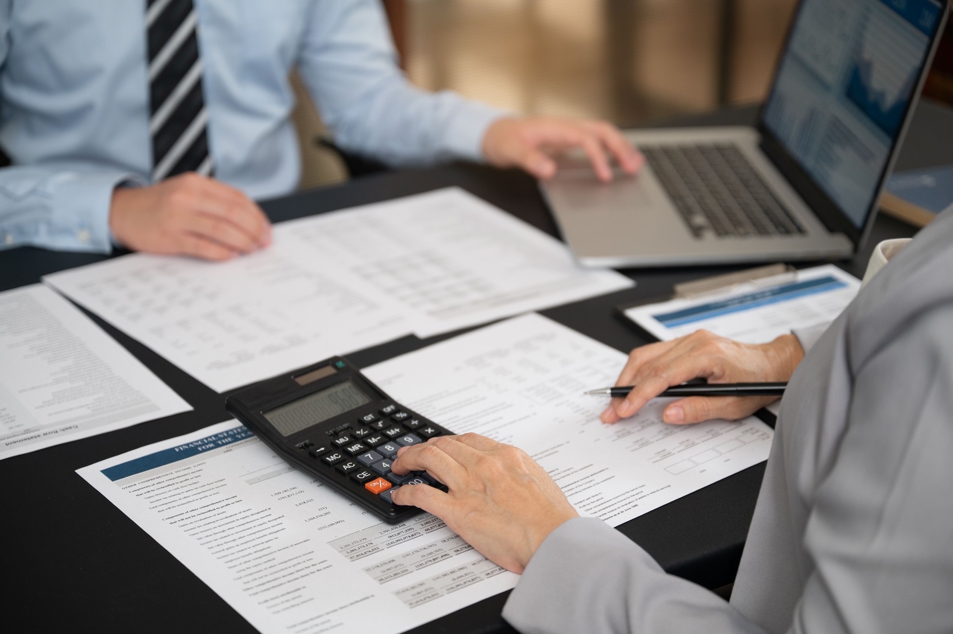 Finance and accountant team working in office for accounting and preparation services for financial statements and cash flow with analyze data insight for finance and taxation planning.
